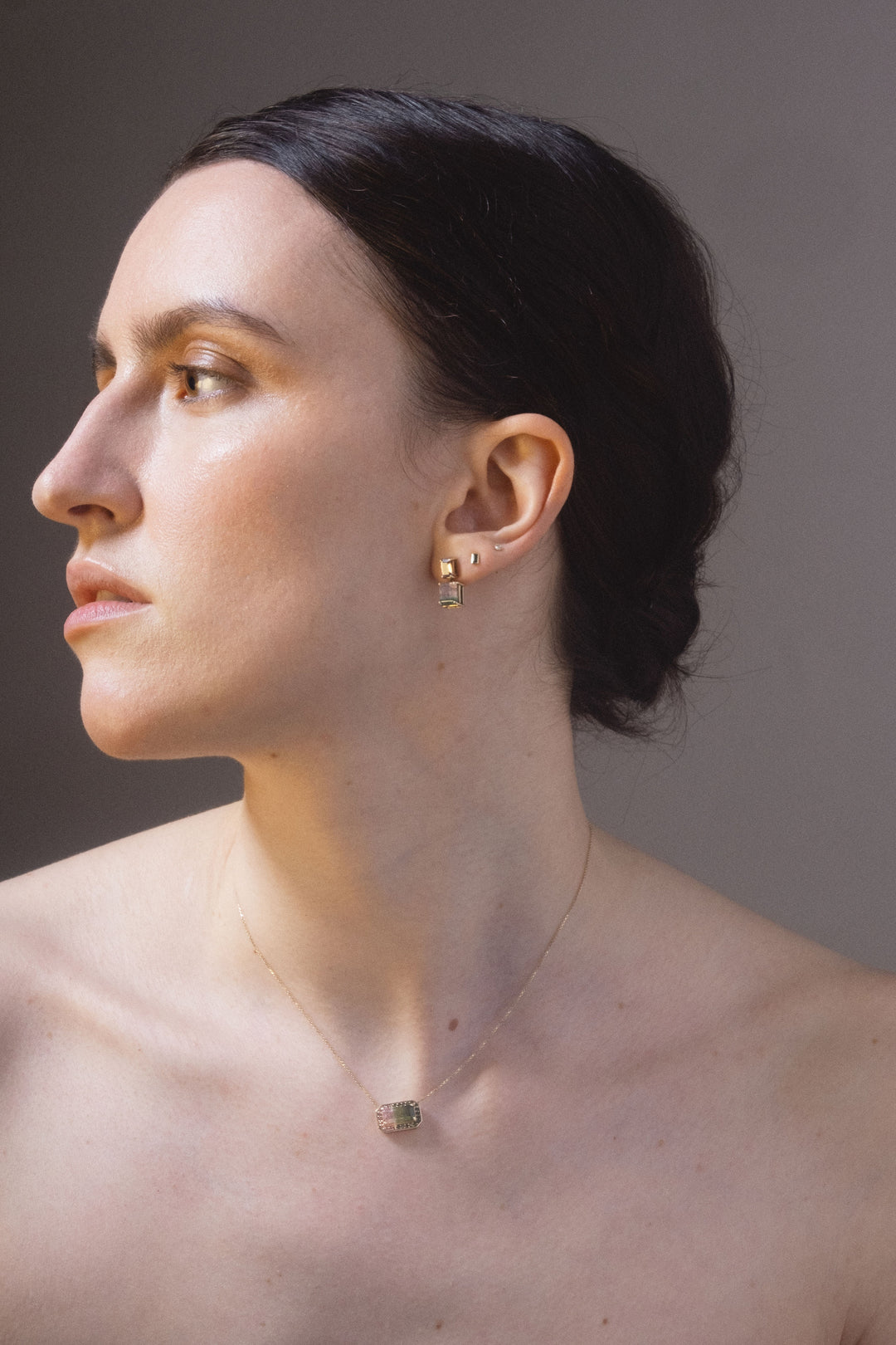 woman wearing genevieve schwartz jewellery watermelon sugar halo pendant and earrings